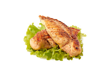 Two roasted chicken breast fillets with lettuce on white