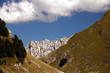Alpi Apuane above the white marble quarries of Carrara. A landscape with Mount Sagro (right side) with clear skies and clouds. (Carrara, Toscana, Italy)