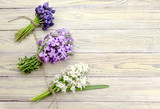 Fototapeta Lawenda - Three of the bouquet on the wooden background