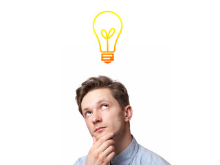 young man with thoughtful expression and light bulb over his head