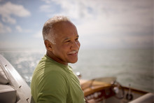Mature Adult Man Sitting On A Boat.