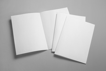 Blank half-folded booklet, postcard, flyer or brochure mockup template on gray background