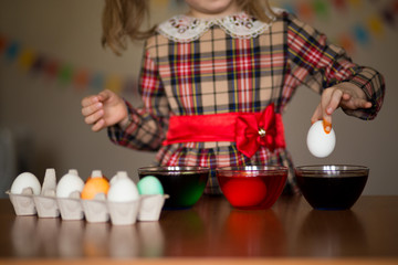 Happy easter. Little girl painter painted eggs. Kid preparing for Easter. Painted hand. Art and craft concept. Traditional spring holiday food