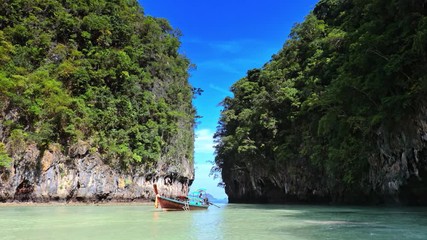 Wall Mural - Amazing beautiful nature of Thailand sea coast. Traditional boat trip on summer vacation holidays in Asia