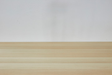 Empty light brown table in white room