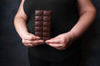 sugar addiction, diet, diabetes prevention, imbalanced ration. overweight woman with chocolate bar. weight loss