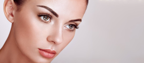 Wall Mural - beautiful woman with extreme long false eyelashes. eyelash extensions. makeup, cosmetics. beauty, sk