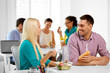 © Syda Productions - corporate, communication and people concept - happy colleagues having lunch and eating at office