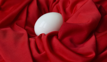 Wall Mural - chicken boiled egg white on red fabric