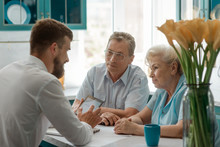 Elderly Clients Consulting An Advisor