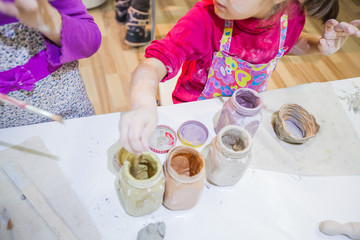 Wall Mural - Two Little Girls At Pottery Workshop