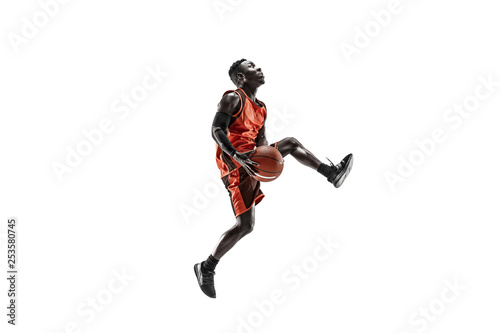 Fotografía Full length portrait of a basketball player with a ball isolated on white studio background