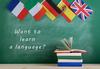 Fototapete - flags of Spain, France, Great Britain and other countries, blackboard with text 