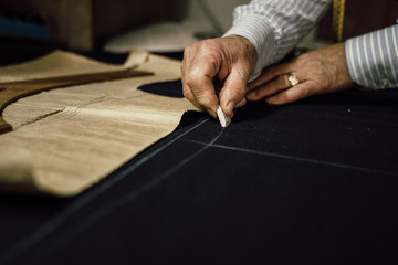 Craftsman tailor at work in the workshop