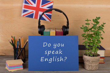 Fototapete - Learning languages concept - blue paper with text 