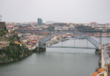 Fototapeta Niebo - Aerial view over River Douro in Porto, Portugal. Rainy, overcast day.