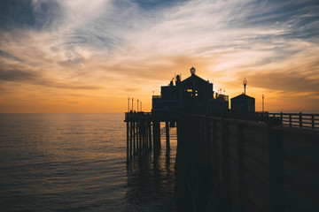 Wall Mural - Pier and building at sunset