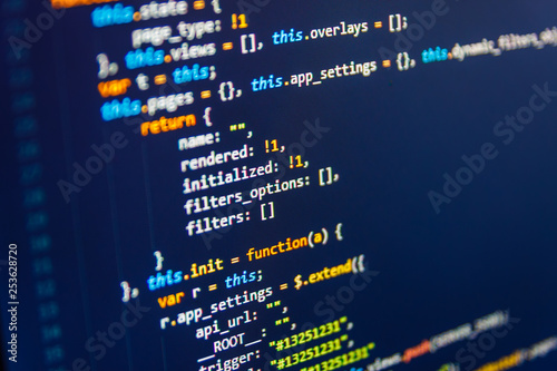 Source PC website developer. Real software development code. JavaScript code in text editor.  Computer interface. Abstract technology background. Java Software engineer concept.