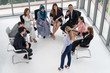 © InfiniteFlow - Businesswomen and businessmen attending group meeting conference in office room. Corporate business team concept.
