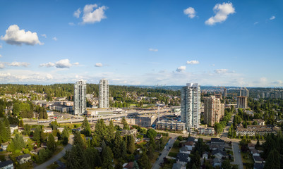 Canvas Print - Aerial view of residential homes in a modern city during a vibrant summer sunny day. Taken in Port Moody, Vancouver, BC, Canada.