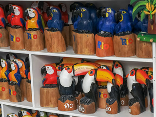 carved wooden toucans and macaws in rio de janeiro