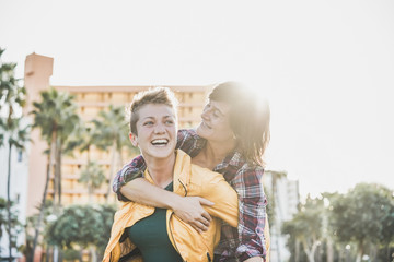 Happy gay couple having fun together outdoor