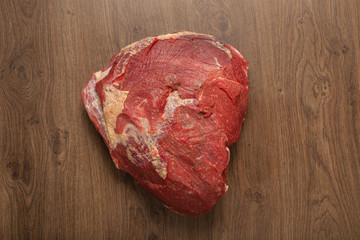 Raw fresh beef on a wooden background, catalog.