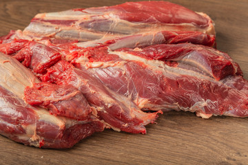 Wall Mural - Raw fresh beef on a wooden background, catalog.