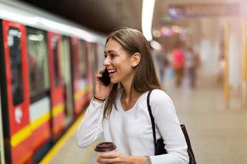 Wall Mural - young woman at subway station