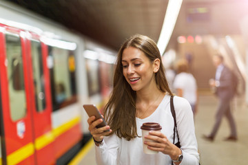 Wall Mural - young woman at subway station