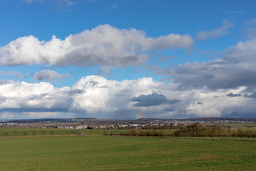 Green fields and blue skies over hessen in Germany