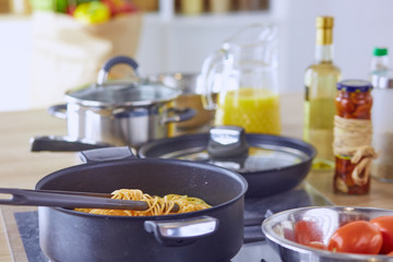 Wall Mural - Composition with wooden board and ingredients for cooking on table