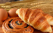 fresh bread danish and croissant wheat on the wooden.