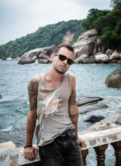 Wall Mural - young man on the beach