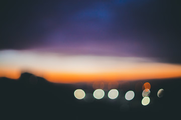Wall Mural - wonderful atmospheric calm dawn in mountains. amazing picturesque romantic sunset. city lights in bo