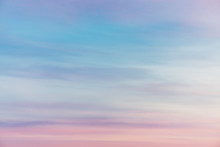 Sunset Sky With Pink Violet Light Clouds. Colorful Smooth Blue Sky Gradient. Natural Background Of Sunrise. Amazing Heaven At Morning. Slightly Cloudy Evening Atmosphere. Wonderful Weather On Dawn.