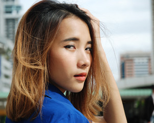 Beautiful woman smile portrait traveling and walking street in the city.	