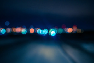 Abstract background - blurred lights on the road. Suitable for design.