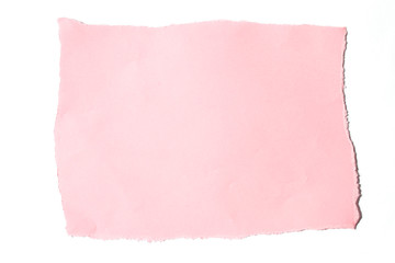 A torn piece of pink paper on a white background.