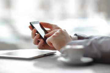 Wall Mural - close up.businessman presses his finger on the screen of the smartphone