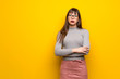 © luismolinero - Woman with glasses over yellow wall portrait