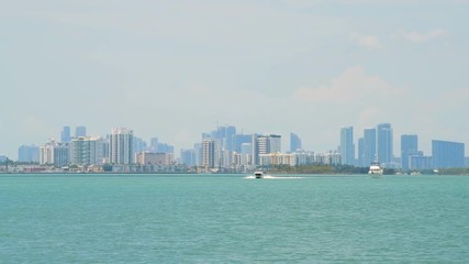 Wall Mural - Miami Florida with Biscayne Intracoastal water during day and closeup view of downtown cityscape skyscrapers and North Bay Village