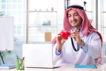 Arab doctor cardiologist working in the clinic 