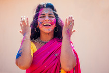 Holi Festival Of Colours. Portrait Of Happy Indian Girl In Traditional Hindu Sari On Holi Color . India Woman Silver Jewelry With Powder Paint On Dress ,colorful Pink And Blue Hair In Goa Kerala