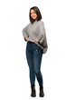 © luismolinero - A full-length shot of a Young woman posing with arms at hip and smiling over isolated white background