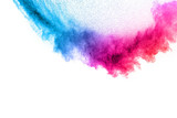 Fototapeta Tęcza - Multi colour powder explosion on white background. Launched colourful dust particles splashing.