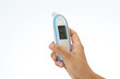 © PixieMe - Hand holding digital thermometer