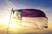 North Carolina State Of United States Flag Waving On The Top Sunrise Mist Fog