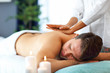 © Kalim - Handsome man having massage in spa salon