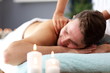 © Kalim - Handsome man having massage in spa salon